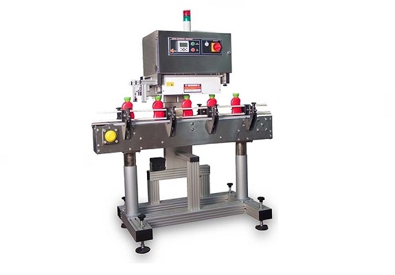 Induction sealing machine GST for hermetic sealing of bottles, jars and cans.